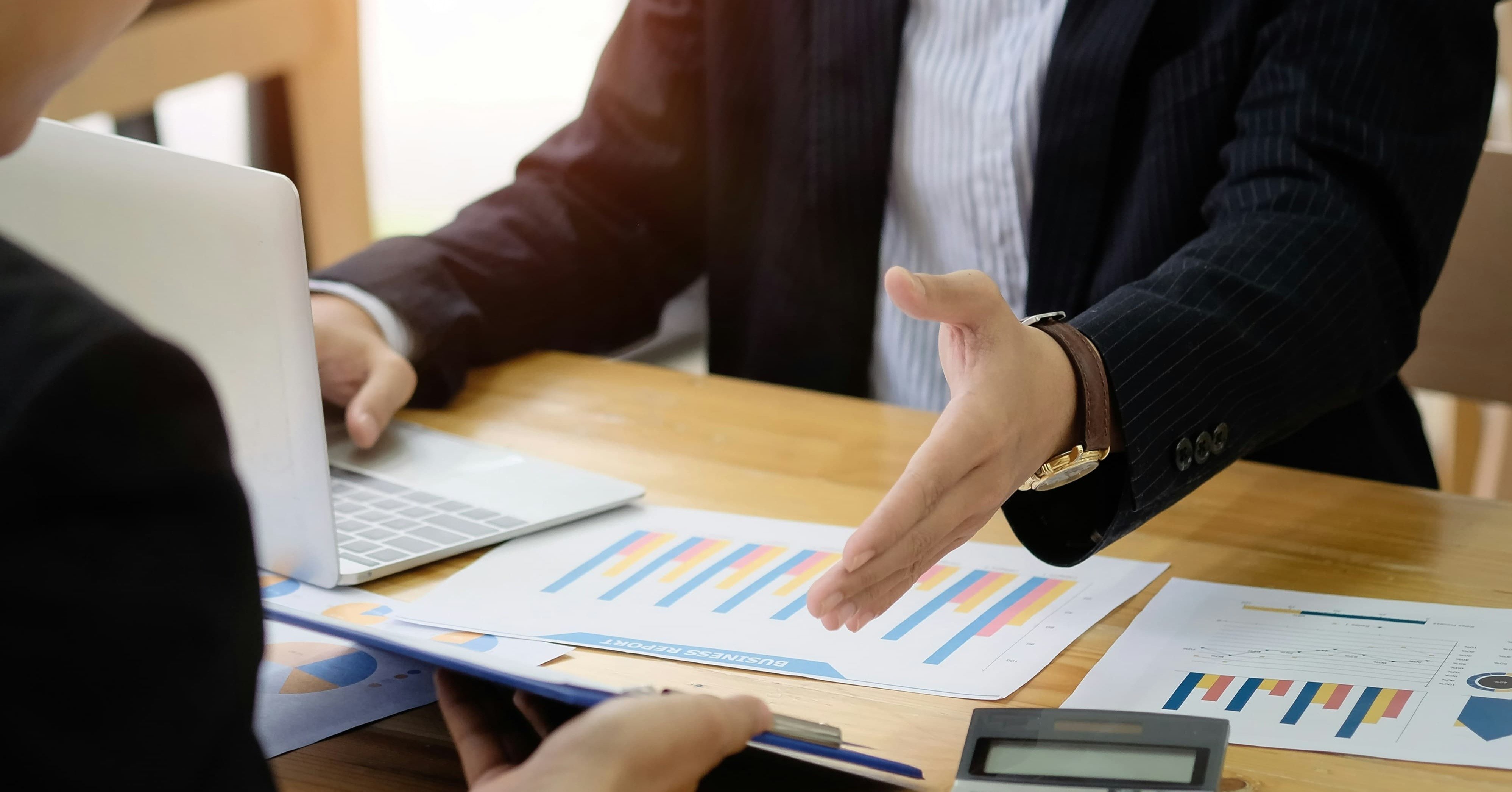 business colleagues analyze a valuation investment and finance control with document paper