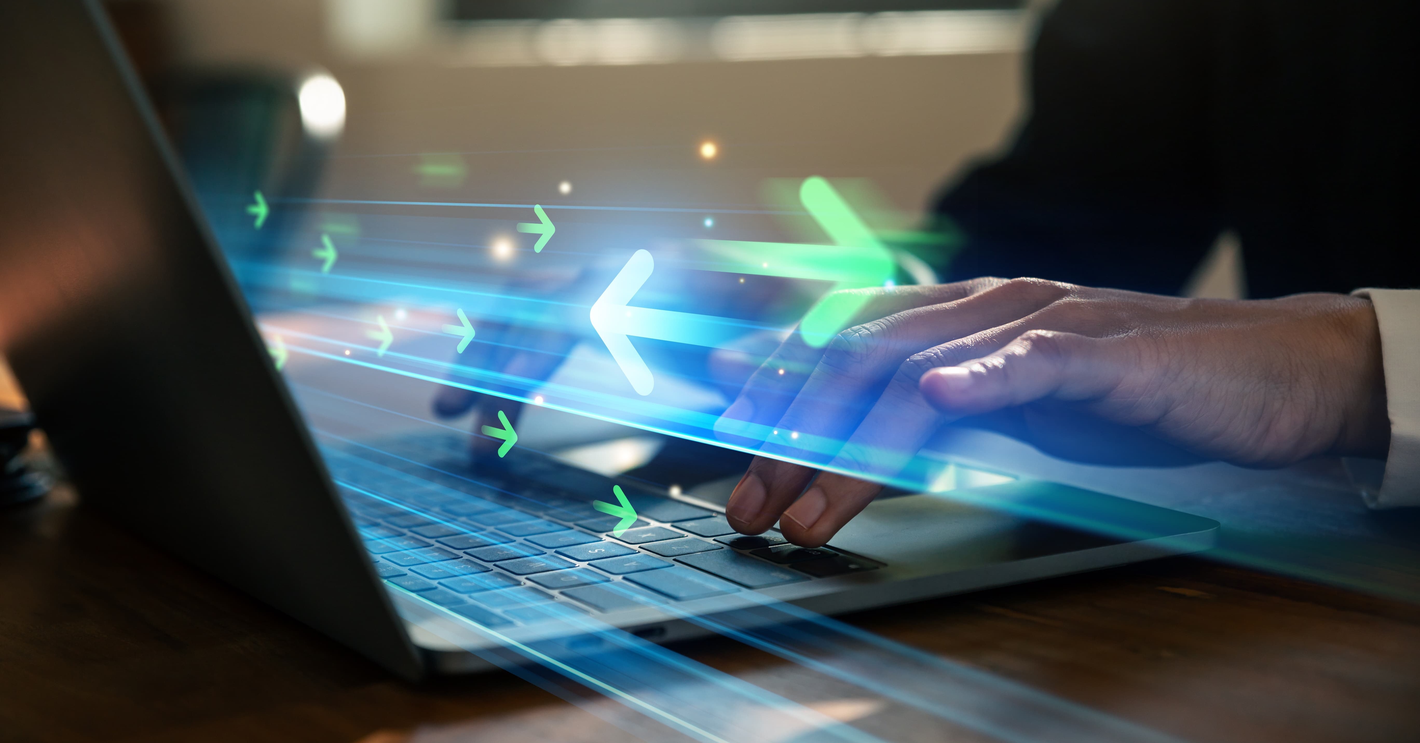 person typing on a computer with arrows flying back and forth. Abstract representation of the concept of data migration.