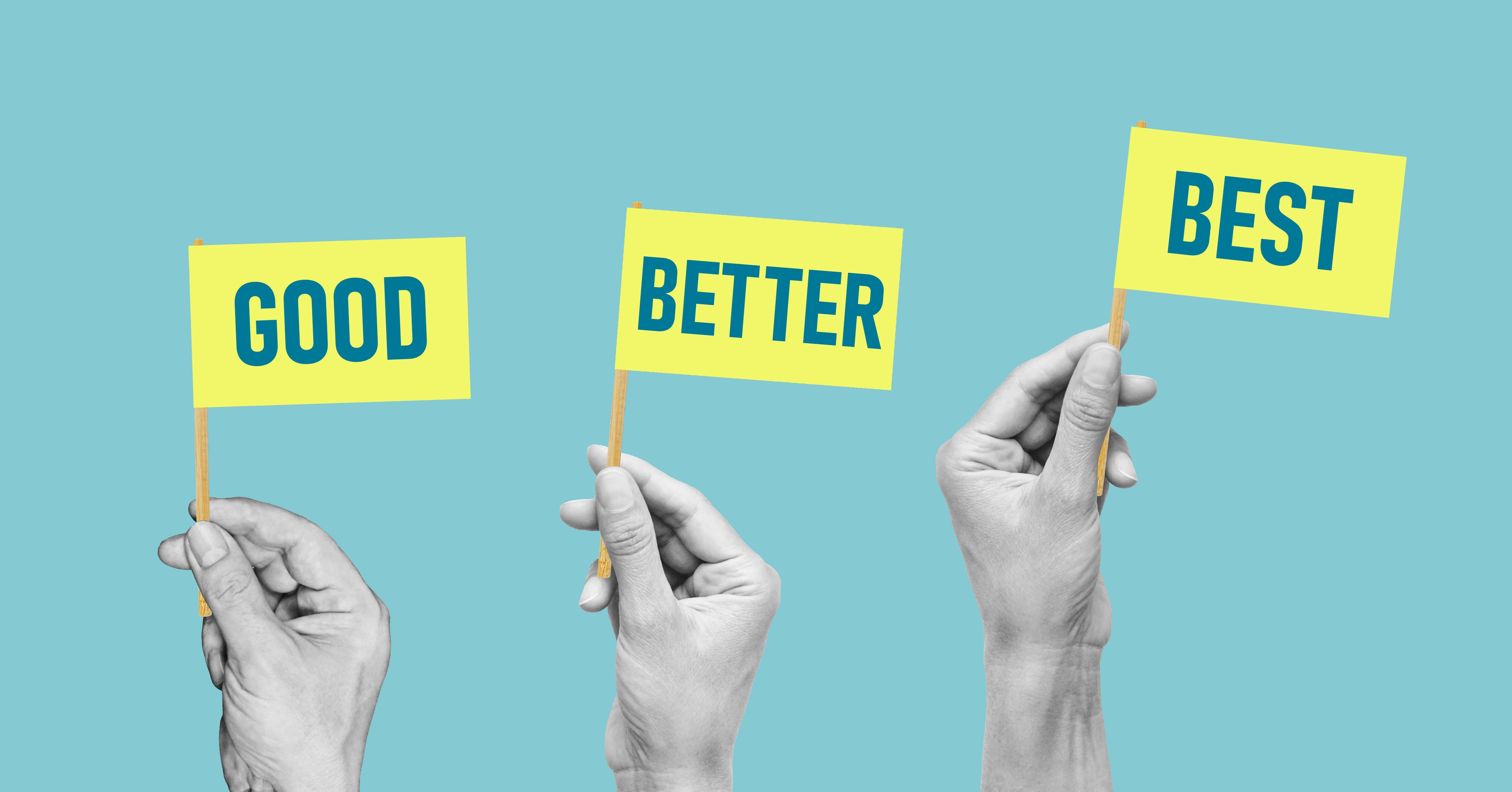 three hands holding signs that say: 